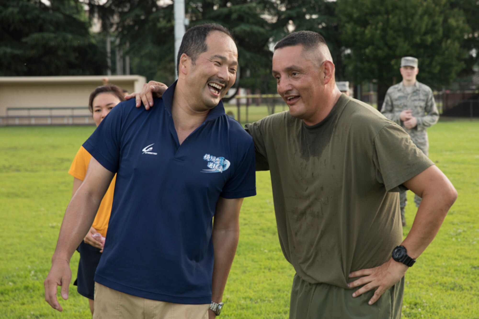 U.S. Marine Corps Sgt. Maj. Mario Marquez, III Marine Expeditionary Force sergeant major, and Japan Maritime Self-Defense Force Master Chief Petty Officer Seki Hideyuki, the Master Chief Petty Officer of JMSDF, greet after a physical training session during the bilateral Senior Enlisted Leader Symposium at Yokota Air Base, Japan, July 14, 2017. USFJ component and JSDF senior enlisted leaders met to strengthen the U.S. and Japan partnership by discussing shared leadership principles including ways each service makes improvements. (U.S. Air Force photo by Yasuo Osakabe)