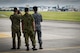 Attendants of a U.S. Forces, Japan and Japan Self-Defense Forces' Senior Enlisted Leader Symposium watch a U.S. Air Force C-130H Hercules takeoff during a C-130J Super Hercules tour, July 14, 2017, at Yokota Air Base, Japan. The Symposium was a two-day event in which USFJ and JSDF component SELs discuss various enlisted leadership development programs, enhancing the coordination between U.S. and Japan, among other topics of mutual concern throughout the Indo-Asia Pacific region. (U.S. Air Force photo by Airman 1st Class Juan Torres)