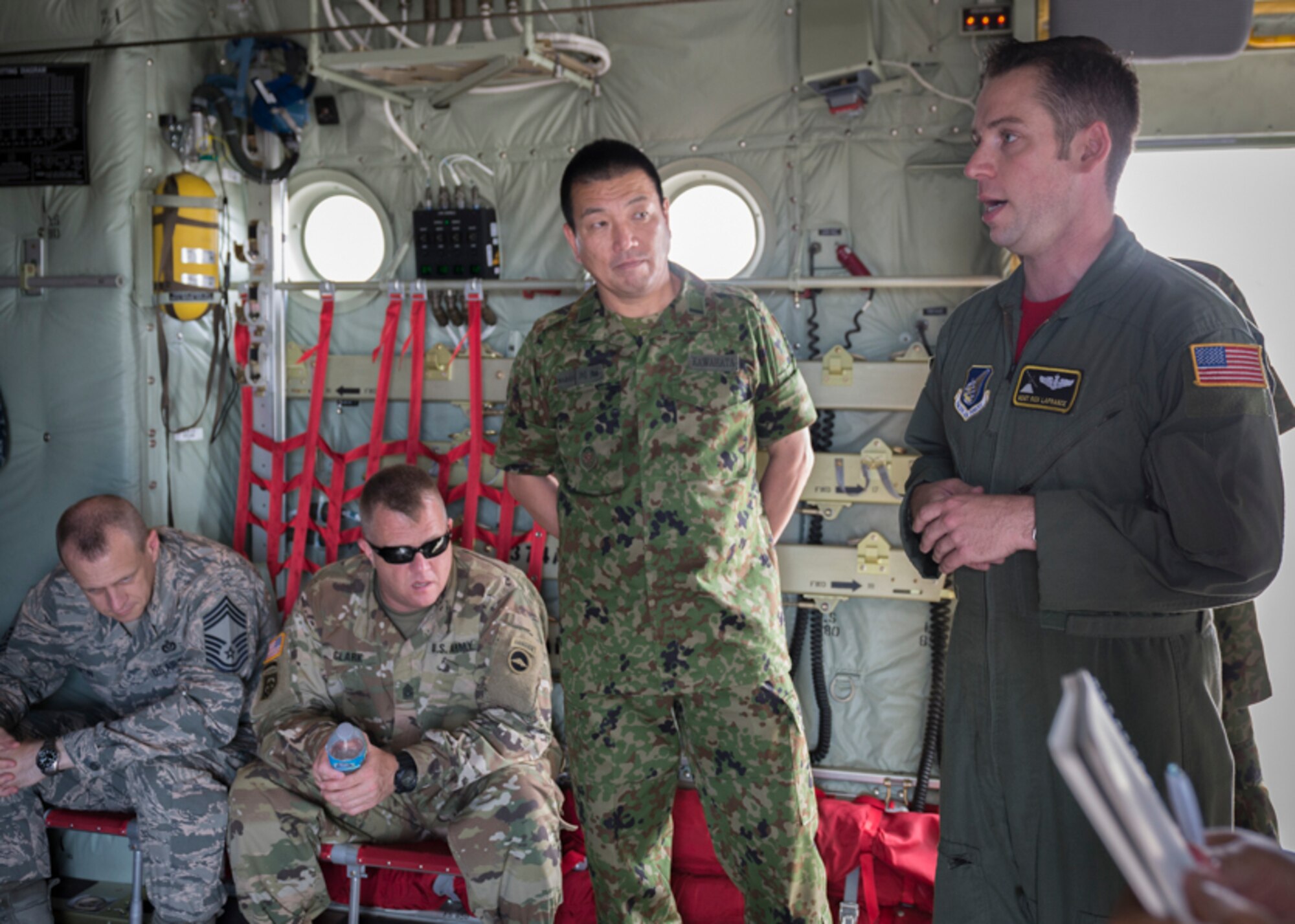 U.S. Air Force Master Sgt. Richard LeFrance, 36th Airlift Squadron loadmaster, gives a briefing to attendants of a U.S. Forces, Japan and Japan Self-Defense Forces' Senior Enlisted Leader Symposium during a U.S. Air Force C-130J Super Hercules tour, July 14, 2017, at Yokota Air Base, Japan. During the Symposium, USFJ component and JSDF senior enlisted leaders met to strengthen the U.S. and Japan partnership by discussing shared leadership principles including ways for each service to make improvements. (U.S. Air Force photo by Airman 1st Class Juan Torres)