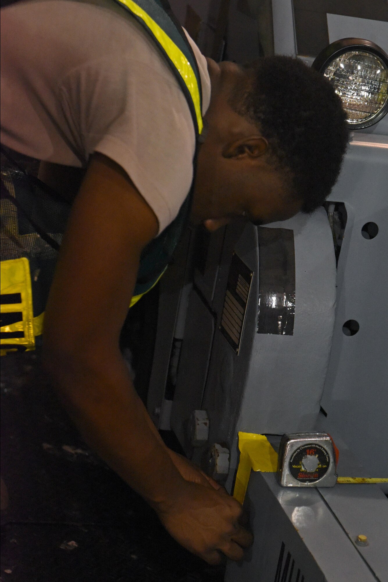 Airman Joshua Shepherd, 4th Logistics Readiness Squadron Travel Management Office receiving technician, places duct tape to mark the balance point on a piece of equipment during Exercise Thunderdome 17-02, July 20, 2017, at Seymour Johnson Air Force Base, North Carolina. Exercises such as this are performed to ensure mission readiness. (U.S. Air Force photo by Senior Airman Ashley Maldonado)