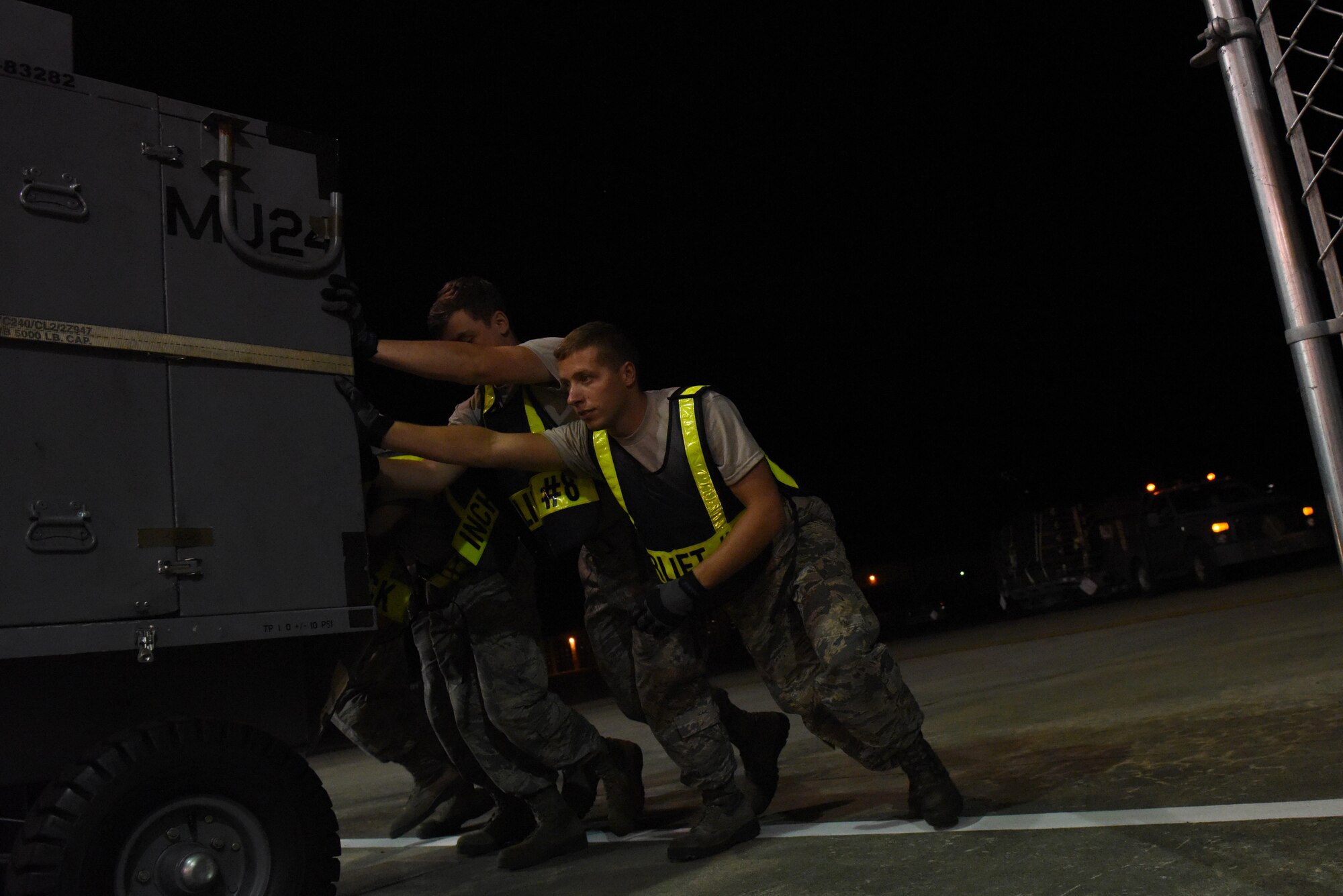 Members from the 4th Fighter Wing move cargo and equipment during Exercise Thunderdome 17-02, July 20, 2017, at Seymour Johnson Air Force Base, North Carolina. Team Seymour regularly performs exercises to ensure readiness in case of a real-world emergency or event. (U.S. Air Force photo by Senior Airman Ashley Maldonado)