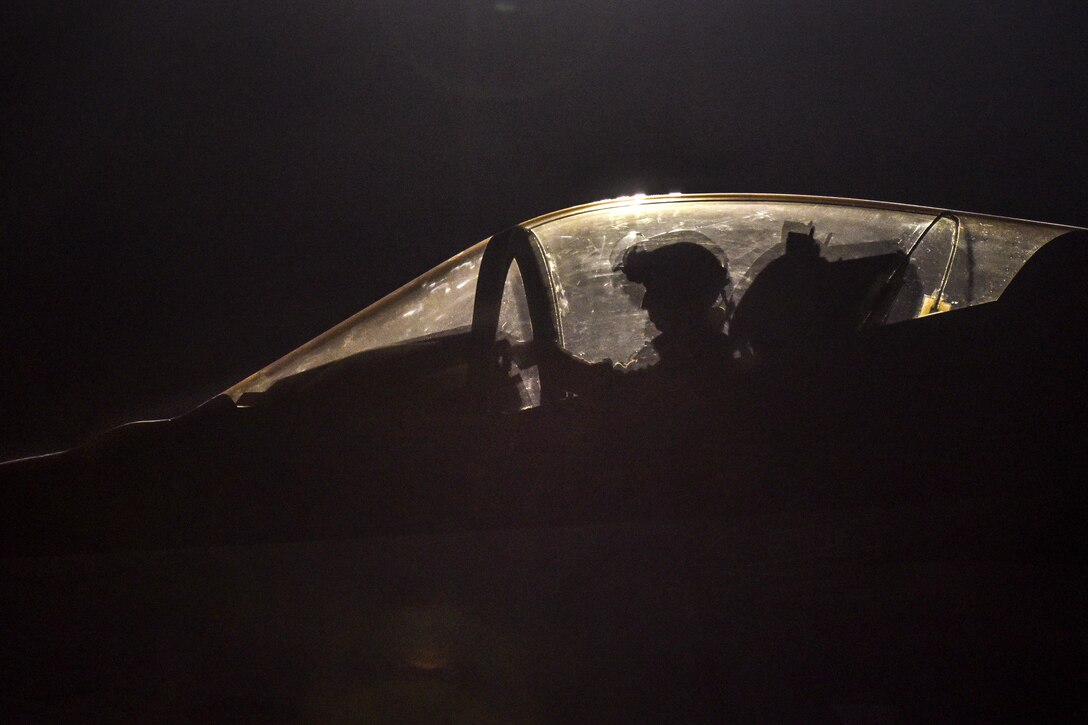 A pilot sits in the cockpit of an F-35A Lightning II awaiting takeoff at night during Red Flag 17-3 at Nellis Air Force Base, Nev., July 14, 2017. Air Force photo by Senior Airman Dustin Mullen