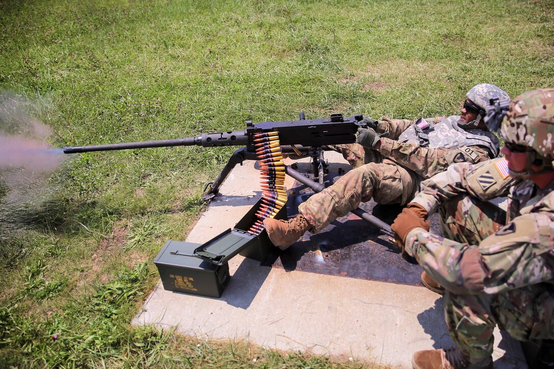 Army Staff Sgt. Qujuan Baptiste fires an M2 .50 caliber machine gun during a weapons qualification range at Camp Atterbury, Ind., July 18, 2017, during Army Materiel Command's Best Warrior Competition. Baptiste is assigned to the Army Sustainment Command. Army photo by Sgt. 1st Class Teddy Wade