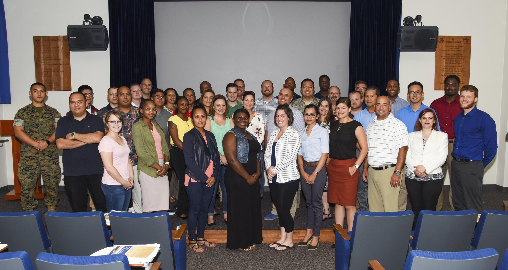 Instructors and participants pose for a group photo upon completion of the Passport Application Acceptance Training at the Professional Development Center, July 19, 2017, at Yokota Air Base, Japan. The two-day annual training is used by the Department of Defense and Department of State to certify passport agents.