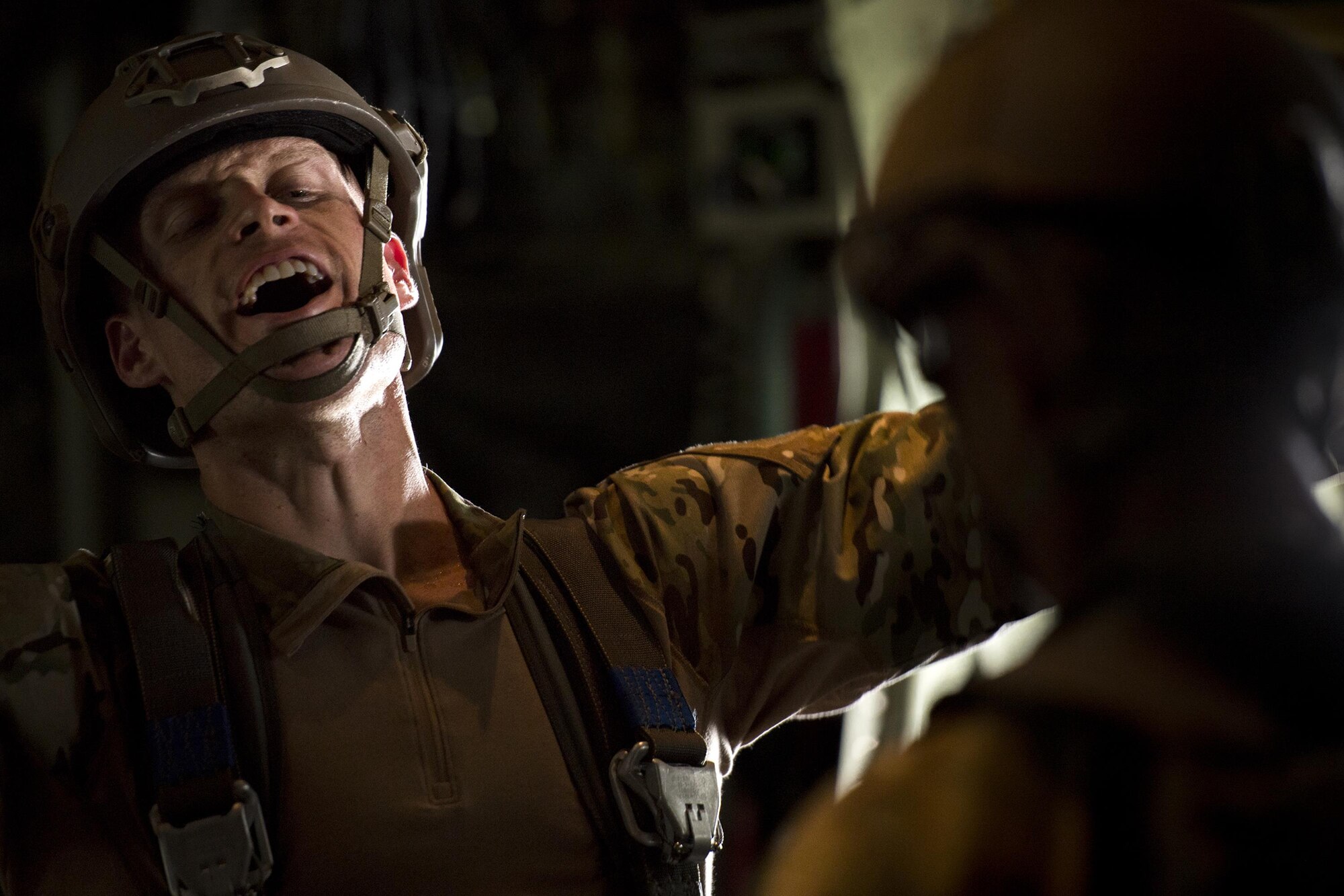 Staff Sgt. Colt Crowe, an 820th Base Defense Group jumpmaster, yells to jumpers prior to a static-line jump, July 14, 2017, in the skies over Moody Air Force Base, Ga. The 820th BDG includes airborne-qualified Airmen to support the expeditionary Air Force’s only worldwide deployable, first-in, self-sustaining force protection capability. (U.S. Air Force photo/Staff Sgt. Ryan Callaghan)
