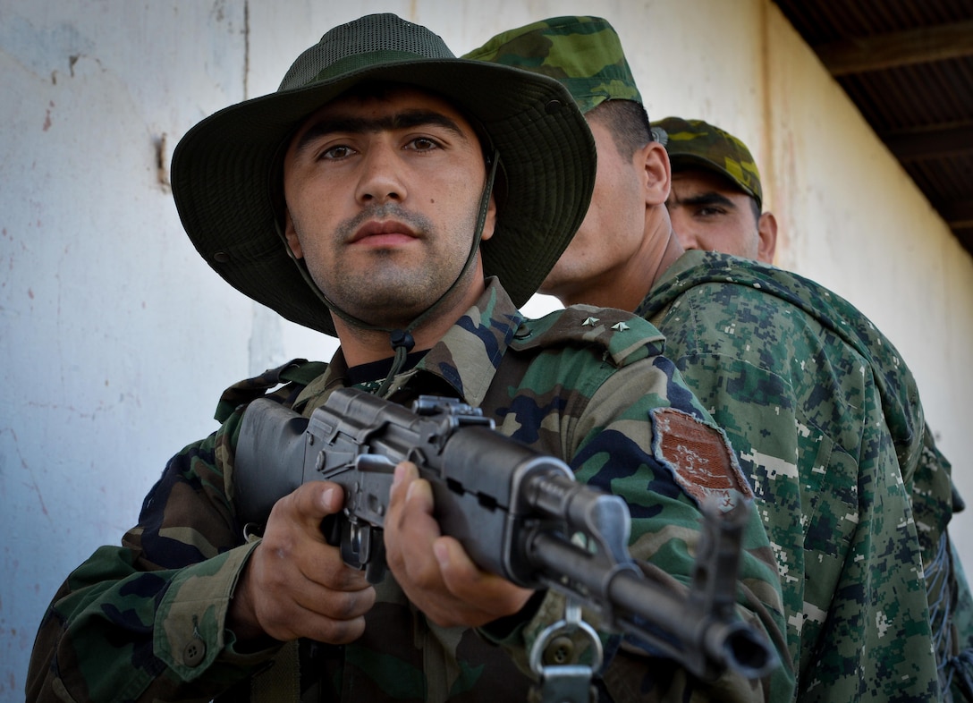 A Tajik service member stands in formation before a close quarters battle practice during a field training exercise part of multinational exercise Regional Cooperation 2017, July 17, 2017, in Fakhrabad, Tajikistan. Regional Cooperation has been conducted annually since 2001; the last exercise was held Sept. 16-28, 2016, in Cape Cod, Massachusetts. (U.S. Air Force photo by Staff Sgt. Michael Battles)