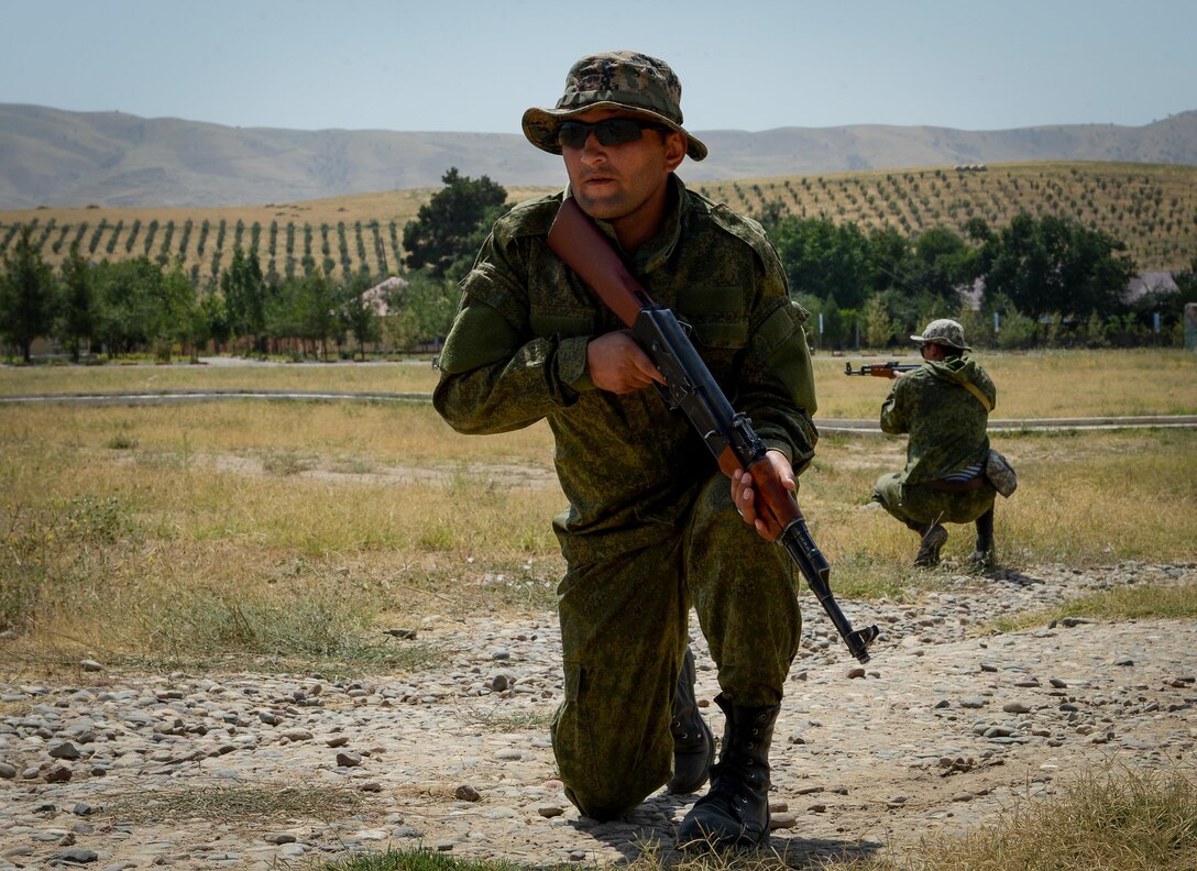 A Tajik service members assumes a defense position during a field training exercise part of multinational exercise Regional Cooperation 2017, July 17, 2017, in Fakhrabad, Tajikistan. Hosted by Tajikistan's Ministry of Defense, RC 17 affords participants the opportunity to exercise a United Nations directive to focus counterterrorism, border security and peacekeeping operations. During RC 17, service members from U.S. Central Command will train alongside the armed forces of Kyrgyzstan, Tajikistan, the Islamic Republic of Pakistan, Mongolia and observers from Kazakhstan. (U.S. Air Force photo by Staff Sgt. Michael Battles)