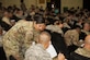 Staff Sgt. Beatriz Zapien, a personnelist assigned to the 386th Expeditionary Force Support Squadron Personnel Support for Contingency Operations sustainment team assists a newcomer with paperwork during an in-processing briefing at an undisclosed location in Southwest Asia, July 16, 2017. PERSCO conducts in-processing briefings with all inbound personnel to ensure 100% accountability as well as to provide a one stop shop for briefings and paperwork processing. (U.S. Air Force photo by Tech. Sgt. Jonathan Hehnly)