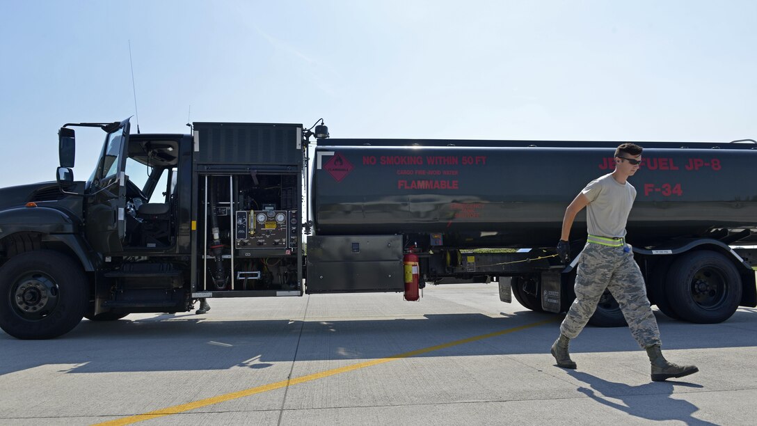 Airman 1st Class Aaron Sewell, 31st Logistics Readiness Squadron Petroleum, Oil and Lubricants distribution operator, grounds a fuel truck, July 19, 2017, at Aviano Air Base, Italy. A metal wire connected to the fuel truck transfers electrical currents to the ground to prevent electrical discharge. (U.S. Air Force photo by Senior Airman Cary Smith)