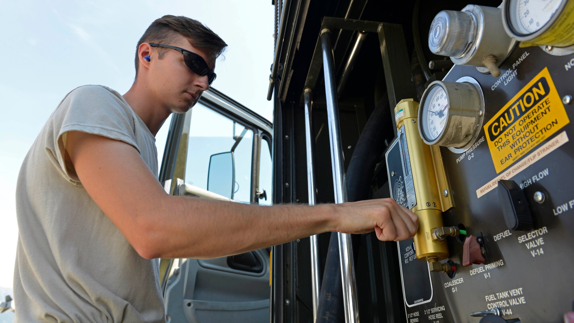 Airman 1st Class Aaron Sewell, 31st Logistics Readiness Squadron Petroleum, Oil and Lubricants distribution operator, adjusts pressure while refueling an F-16 Fighting Falcon, July 19, 2017, at Aviano Air Base, Italy. The gauge panel allows POL Airmen to monitor the fuel transfer and adjust air pressure as needed. (U.S. Air Force photo by Senior Airman Cary Smith)