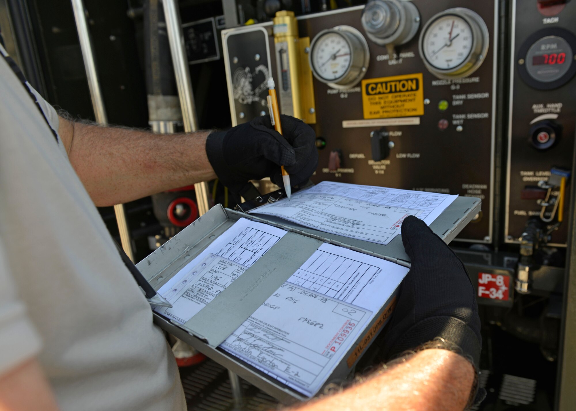 Senior Airman Matthew Ronan, 512th Logistics Readiness Squadron Petroleum Oil and Lubricants distribution operator, Dover Air Force Base, Delaware, records fuel and gauge numbers after refueling an F-16 Fighting Falcon, July 19, 2017, at Aviano Air Base, Italy. Air Force reservists assigned to the 512th LRS, Dover AFB, Delaware, joined the 31st LRS for two weeks of distance training at Aviano. (U.S. Air Force photo by Senior Airman Cary Smith)