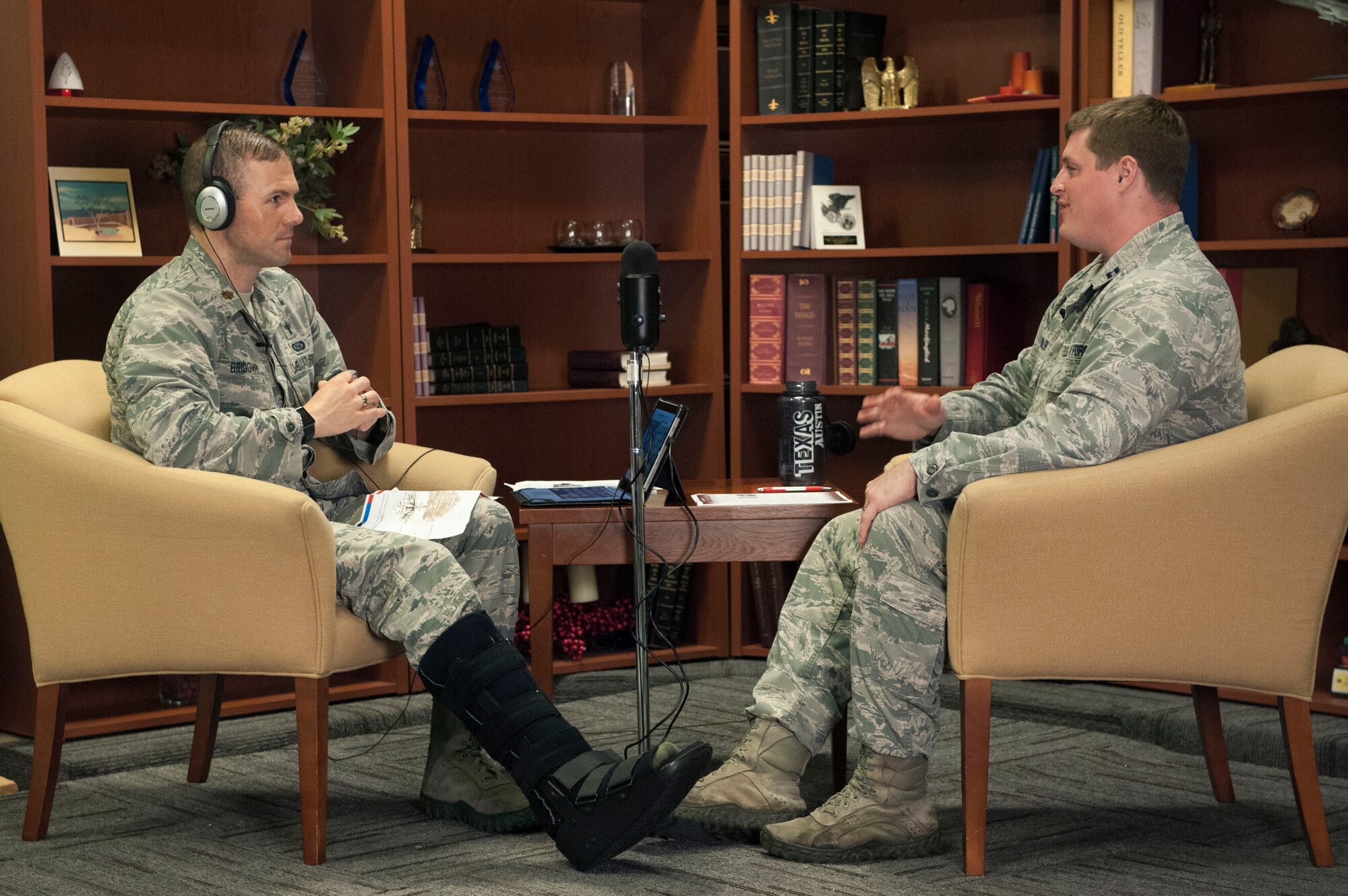 Photo of Chaplain (Maj.) Jim Bridgeham, and Capt. Jerry Walker, wing psychologist and acting wing surgeon general recording a resilience podcast