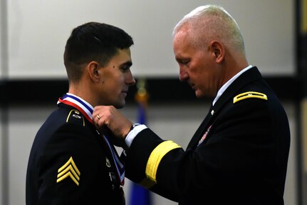 Army Brig. Gen. Jon A. Jensen, right, commanding general of the 34th Infantry Division, awards  Army Sgt. Grant Reimers, a heavy vehicle operator with the Nevada Army National Guard’s 1859th Transportation Company, top honors in the Soldier category of the 2017 Army National Guard Best Warrior Competition.  Reimers beat out six other Soldiers from throughout the Army Guard to be named the Army Guard’s Soldier of the Year and will move on to compete in the Department of the Army Best Warrior Competition this fall, battling it out with Soldiers from throughout the Army to be named the Army’s Soldier and NCO of the Year. (U.S. Army photo by Sgt. 1st Class Jon Soucy)