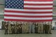Royal Air Force Air Cadets and U.S. Air Force Airmen pose for a group photo at Hangar 1 on Spangdahlem Air Base, Germany, July 20, 2017. The cadets visited several different squadrons around base to give them a glimpse into U.S. Air Force operations. (U.S. Air Force photo by Staff Sgt. Jonathan Snyder)