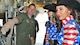 Senior Master Sgt. Gary Taiclet, Operations Superintendent for the 34th Aeromedical Evacuation Squadron, explains to the 2017 Pikes Peak or Bust Rodeo ambassadors, the Girls of the West, how a C-130 Hercules configures to transport injured personnel at Peterson Air Force Base, Colo., June 28 2017. Girl of the West, Jaime Tyler, center, and her aide, Sierra Silva, right, visited the 302nd Airlift Wing to gain a better understanding of the Reserve mission here. (U.S. Air Force photo/Daniel Butterfield)