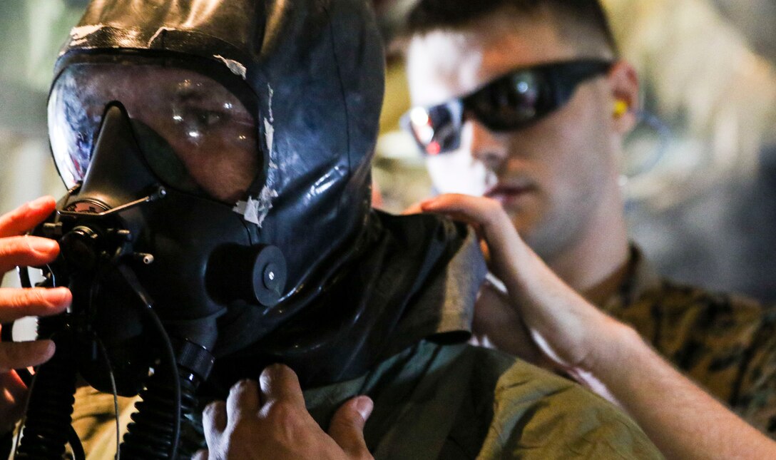 Marines assigned to Marine Aerial Refueler Transport Squadron 252 participate in a Chemical, Biological, Radiological, and Nuclear training exercise at Marine Corps Air Station Cherry Point, July 13, 2017. The training expanded upon the Marines knowledge of how to properly react and contain a CBRN attack aboard a KC-130J Super Hercules. VMGR-252 is assigned to Marine Aircraft Group 14, 2nd Marine Aircraft Wing. (U.S. Marine Corps photo by Cpl. Jason Jimenez/ Released)