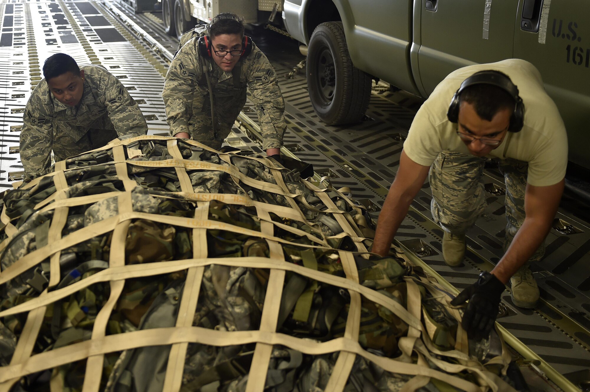 Aerial porters from the 321st Contingency Response Squadron position cargo on a C-17 Globemaster III aircraft during Exercise Saber Guardian ‘17 at Bezmer Air Base, Bulgaria, July 19, 2017.  Saber Guardian is a U.S. Army Europe-led exercise taking place in Bulgaria, Romania, and Hungary.  This exercise involves more than 25,000 service members from 22 allied and partner nations.  (U.S. Air Force Photo by Tech. Sgt. Liliana Moreno/Released)