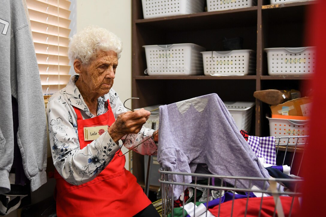Hill Thrift Shop volunteer Lela Gibson puts a shirt onto a hanger, Hill Air Force Base, Utah, July 20, 2017. Gibson has volunteered at the store since 2009 and will celebrate her 100th birthday Aug. 5. (U.S. Air Force photo/R. Nial Bradshaw)