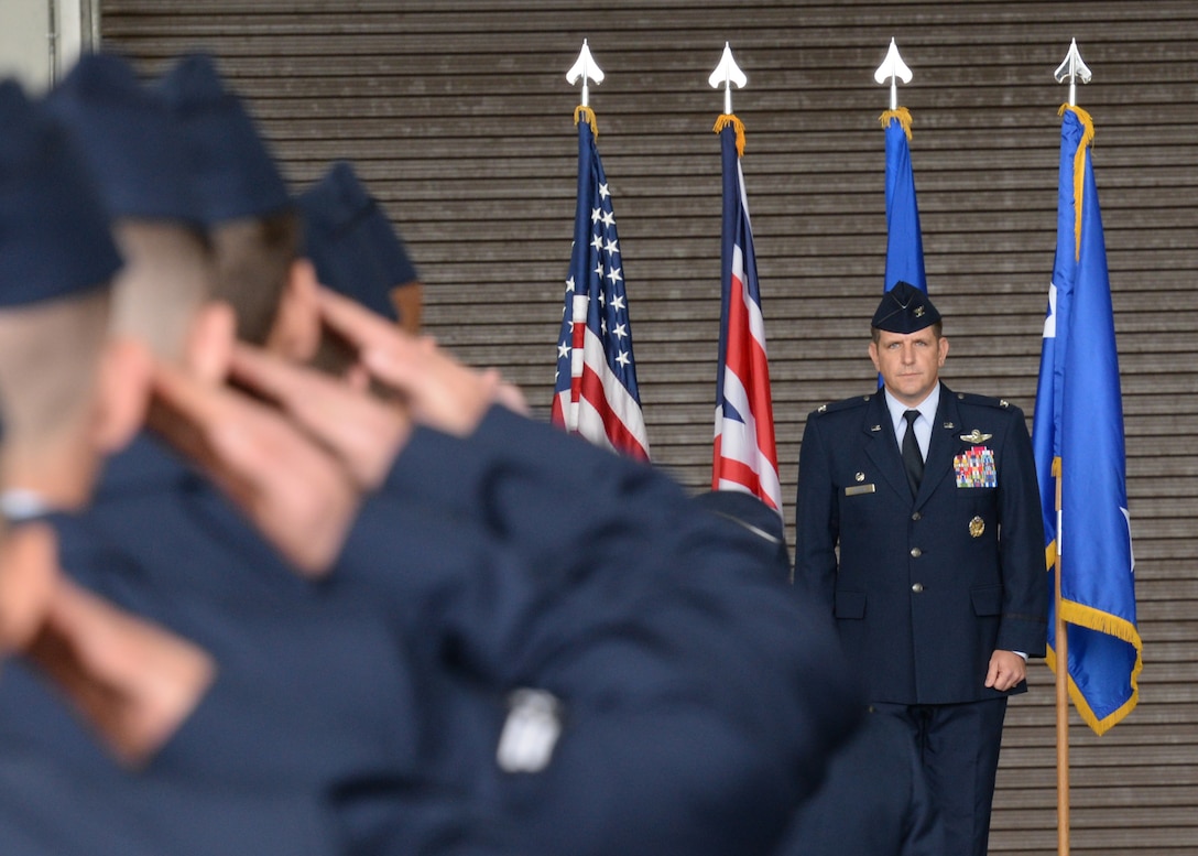 U.S. Air Force Col. Christopher Amrhein receives his first salute as the commander of the 100th Air Refueling Wing July 21, 2017, during the change of command ceremony on RAF Mildenhall, England. Airmen, families, friends and members of the local community came to bid farewell to the outgoing commander, Col. Thomas Torkelson, and welcome Amrhein and his family. (U.S. Air Force photo by Senior Airman Justine Rho)