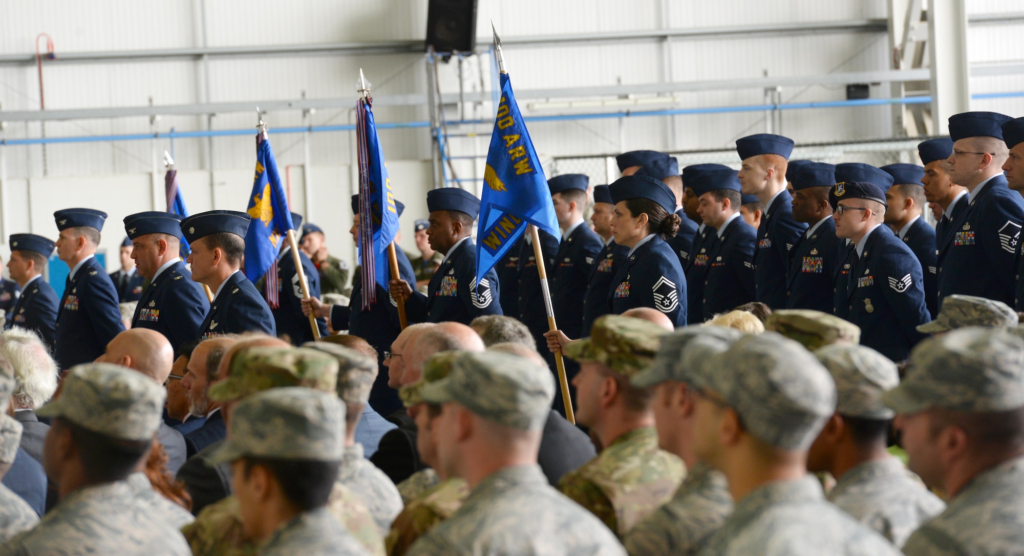 Airmen stand in formation during the 100th Air Refueling Wing change of command ceremony July 21, 2017 on RAF Mildenhall, England. The formation represents the base population when rendering the final salute to the outgoing commander, Col. Thomas Torkelson, and the first salute to the 100th ARW Commander Col. Christopher Amrhein. (U.S. Air Force photo by Senior Airman Justine Rho)