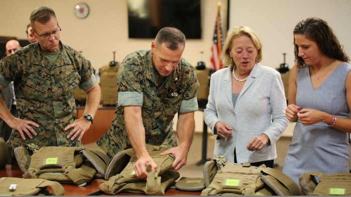 Massachusetts Congresswoman Niki Tsongas joins Marine Corps Systems Command acquisition experts aboard Marine Corps Base Quantico, Virginia, July 11, for a sneak peek at the latest gear for the 21st Century Marine. In a series of ongoing efforts, the Corps and the Army are collaborating to develop, test and deliver ever-better capabilities for Marines and Soldiers. From left: Brig. Gen. Joseph Shrader, MCSC commander; Lt. Col. Chris Madeline, program manager for Infantry Combat Equipment; Rep. Tsongas; and Mackie Jordan, an engineer in PM ICE. (U.S. Marine Corps photo by Emily Greene) 