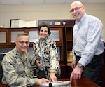 Col. (Dr.) Erik K. Weitzel (left) is briefed on the Burn Navigator by Jose Salinas, Ph.D. and Maria Serio-Melvin. Weitzel took over as deputy commander of the U.S. Army Institute of Surgical Research in May at Joint Base San Antonio-Fort Sam Houston.