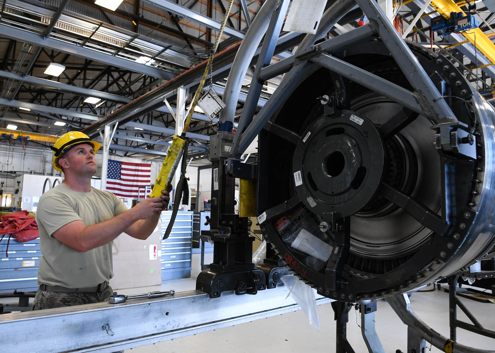 Senior Airman Jason Kippen, 419th Maintenance Squadron Propulsion Flight, moves an F110-GE-100 jet engine onto a work stand, Hill Air Force Base, Utah, July 13, 2017. (U.S. Air Force photo/R. Nial Bradshaw)