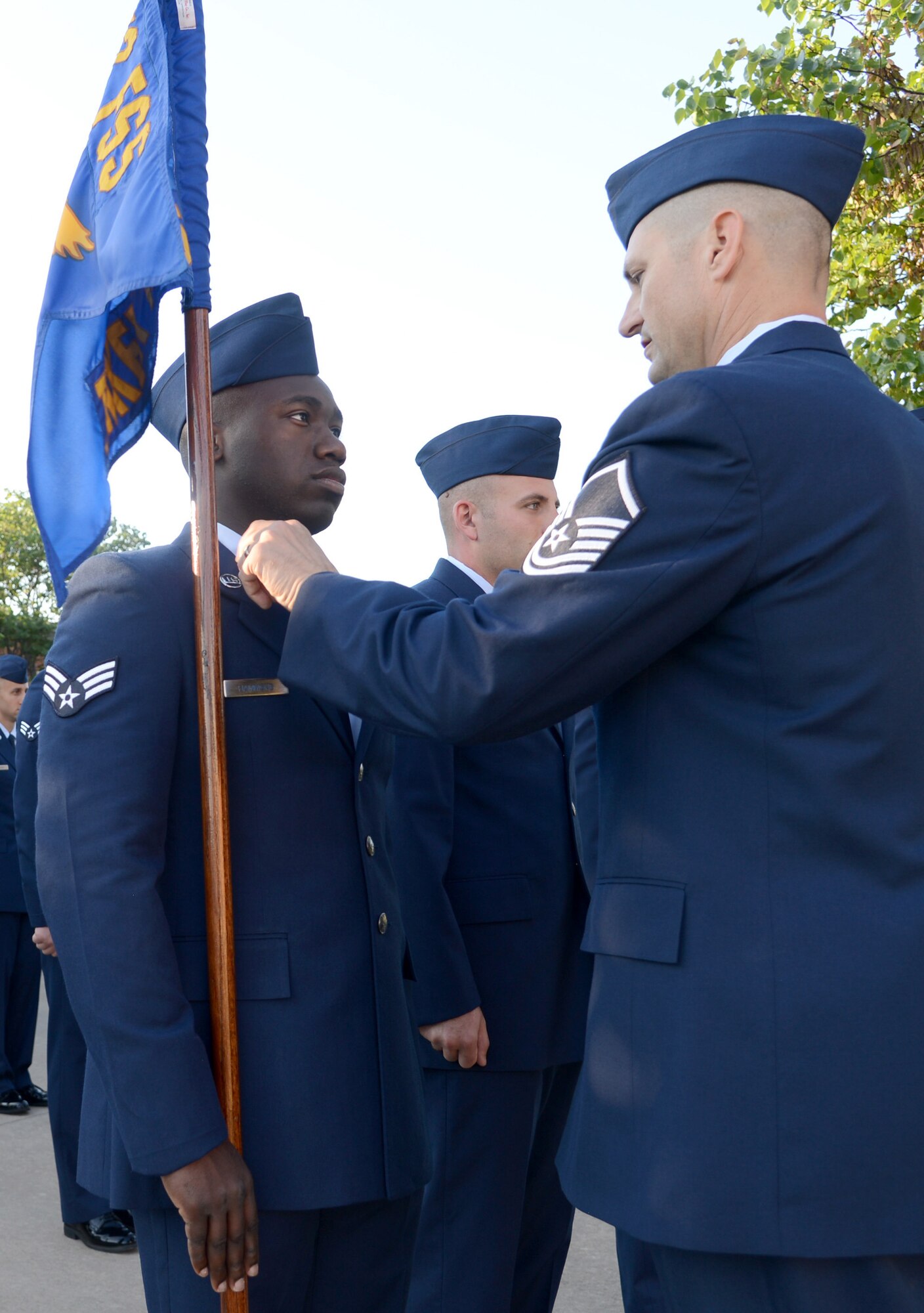 Master Sgt. Bobby Kazmir, Airman Leadership School commandant, inspects the service dress uniform of Senior Airman Malek, with the 552nd Maintenance Squadron. Sergeant Kazmir conducts three uniform inspections during each five-week course for each uniform: ABU’s, service uniform and service dress uniform. As part of their Customs and Courtesies curriculum, the inspections help the students take pride in their uniform and understand the importance of it. (Air Force photo by Kelly White)