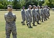 Master Sgt. Rachael Long, one of four Airman Leadership School instructors, evaluates her flight as they display their drill formations. As part of Military Customs and Courtesies curriculum, the students spend numerous hours practicing for their drill evaluations. Each student has the opportunity to lead their flight, calling out drill commands around the field beside the ALS schoolhouse. The flights practice on their own time, leading up to the practice evaluation with their instructor, allowing time to correct and hone their skills until the day of their final evaluation. This part of their curriculum helps the students refresh skills they may not have used since basic training and understand the importance of a practice rich in military history and tradition. (Air Force photo by Kelly White)