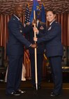 Col. Kenyon Bell, 72nd Air Base Wing commander, passes the guidon of the 72nd Comptroller Squadron to Maj. Yesun Yoon during a change of command ceremony July 12 at the Tinker Club. As the squadron commander, Major Yoon will be responsible for 194 Comptroller and Wing Staff Agency personnel. As chief financial officer of the 72nd Air Base Wing, she will plan and execute a $307 million operating budget and provide financial customer service to more than 65,000 military, civilians, retirees and Reserve personnel. The squadron certifies over $15 billion annually for the Oklahoma City Air Logistics Complex, 552nd Air Control Wing, Navy Strategic Communication WingONE, 507th Air Refueling Wing and 45 other associate units. (Air Force photo by Kelly White)
