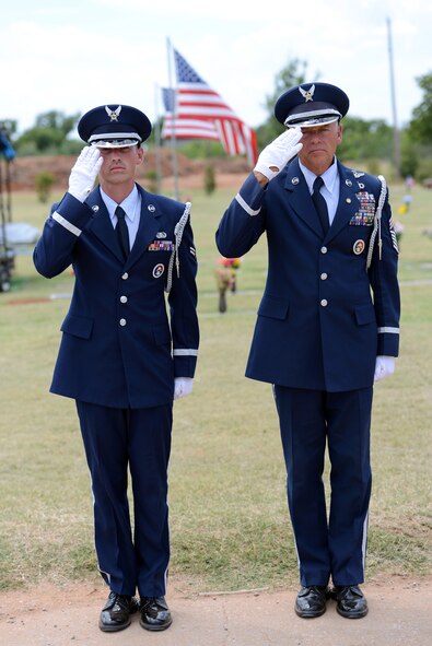 Airman 1st Class Philip Hendricks and retired Chief Master Sgt. Kevin Terrell issue a salute to the arrival of a deceased service member at a recent military funeral ceremony. Four members of the Tinker Honor Guard recently participated in a pilot professional development course based on the book, “The Final Salute.” Participants were able to candidly discuss how serving in the Honor Guard and honoring those who have served has made a significant impact in their lives and careers. (Air Force photo by Kelly White)