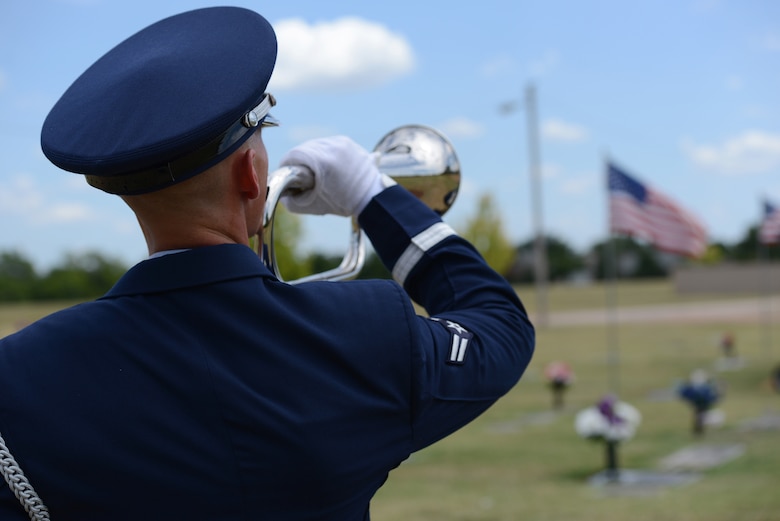 Airman 1st Class Philip Hendricks plays Taps as one of the duties of the Honor Guard during military funeral ceremonies. Final Salute, a pilot professional development course recently offered to volunteer members of the Tinker Honor Guard, helped enhance the impact the military presents to grieving family members during military funeral ceremonies as well as the impact that feeling of pride can have in the rest of the Guardsman’s life and career. (Air Force photo by Kelly White)