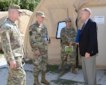 The U.S. Army Deputy Chief of Staff, or G2, Lt. Gen. Robert Ashley (second from left), visited the Intelligence and Security Command Detention Training Facility, or IDTF, at Joint Base San Antonio-Camp Bullis recently. The IDTF provides a multidiscipline Foundry training platform specializing in realistic training environments enabling commanders to train and certify individual on collective intelligence tasks. The IDTF provides an intelligence range, methods for integrating maneuvers, a scenario environment and facilities supporting IT architecture and other critical training enablers, such as role players and a signals intelligence environment, to create realistic live collection opportunities in accordance with training and evaluation guidelines. In the photo, from left, Col. James C. Royse, Ashley, Lt. Col. Kimberly Marquez and Mark Stanley toured the IDTF and observed an ongoing exercise. 