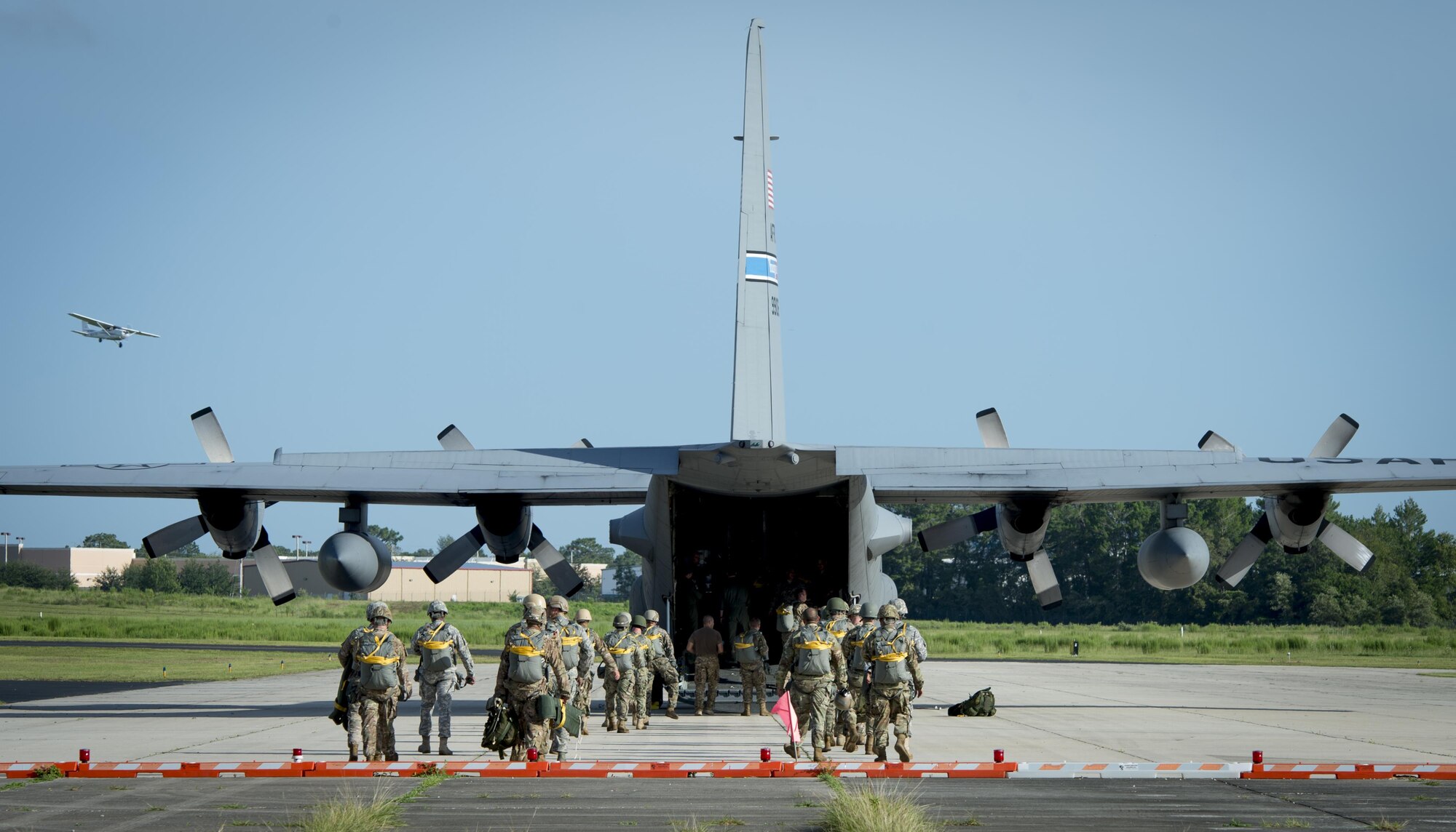 Service members from MacDill Air Force Base, Fla., load into a C-130 Hercules aircraft before their flight in Brooksville, Fla., July 15, 2017. Airborne service members must jump every three months to remain qualified. (U.S. Air Force photo by Senior Airmen Mariette Adams)