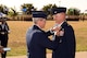 U.S. Air Force Maj. Gen. Robert LaBrutta, 2nd Air Force Commander, presents the Legion of Merit award to Col. Michael Downs, 17th Training Wing Commander, at the parade field on Goodfellow Air Force Base, Texas, July 21, 2017. The Legion of Merit is a military award of the United States Armed Forces that is given for exceptionally meritorious conduct in the performance of outstanding services and achievements. (U.S. Air Force photo by Airman 1st Class Randall Moose/Released)
