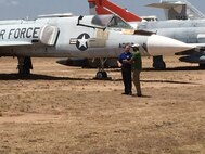 Tim Gray, 309th Aircraft Maintenance Group deputy director, conducts an interview with Craig Melvin on display row July 13 at Davis-Monthan Air Force Base, Ariz. The interview is scheduled to air as part of NBC’s Weekend Today live broadcast on July 29. (Courtesy photo)
