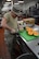 Tech. Sgt. Antony Lucia, 145th Airlift Wing services Airman, prepares cantaloupe for Northern Lightning 2017 participants at Volk Field Air National Guard Base, Camp Douglas, Wis., May 9, 2017. The 40 services Airmen and Soldiers from across the nation prepared meals for approximately 6,500 exercise participants during the two-week exercise. (U.S. Air National Guard photo by Staff Sgt. Andrea F. Rhode)
