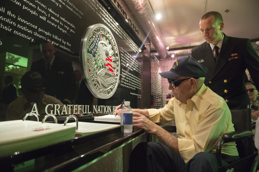 USS Arizona survivor Navy veteran Howard Kenton Potts signs the guestbook at the Pentagon, July 17, 2017. Potts is one of five known living survivors of the Arizona, which was sunk during the Japanese attack on Pearl Harbor, Dec. 7, 1941. DoD photo by EJ Hersom