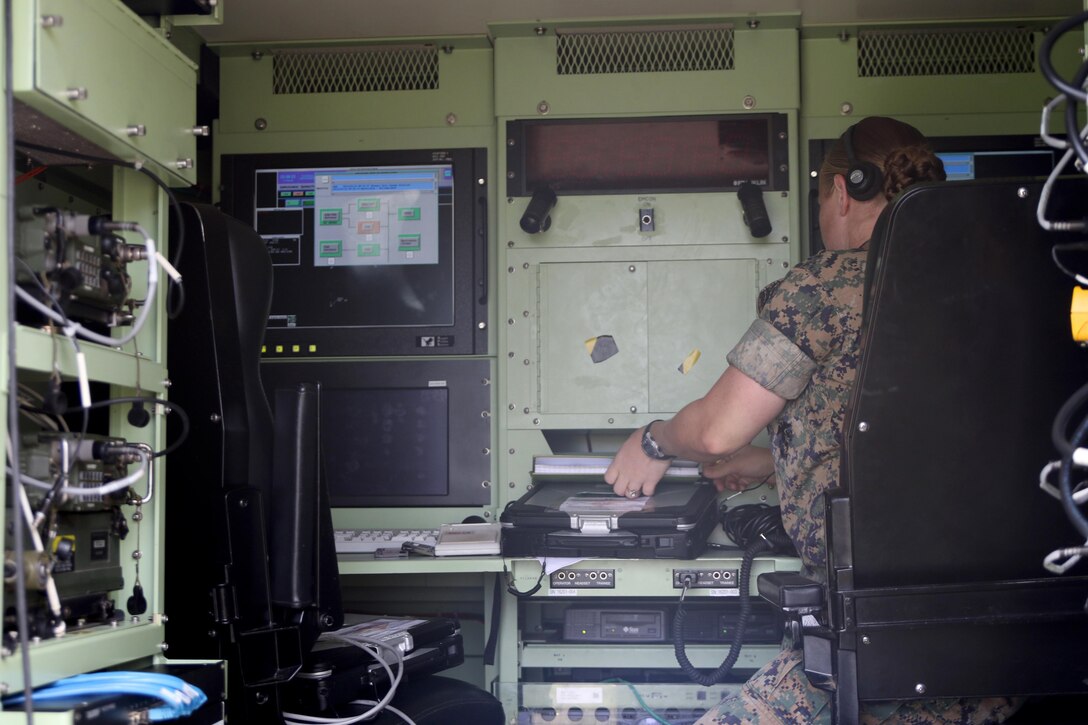 Staff Sgt. Melody Battaglia works inside the AN/TPS-31A V7 Air Traffic Navigation, Integration, and Coordination System operator shelter during a week-long training exercise at Marine Corps Air Station Cherry Point, N.C., July 17, 2017. The ATNAVICS is an expeditionary radar system which allows Marines assigned to air traffic control to establish a functioning an airfield throughout areas of operation around the globe. Battaglia is an air traffic control communications technician assigned to Detachment Charlie, Marine Air Control Squadron 2, Marine Air Control Group 28, 2nd Marine Aircraft Wing. (U.S. Marine Corps Photo by Pfc. Skyler Pumphret/ Released)