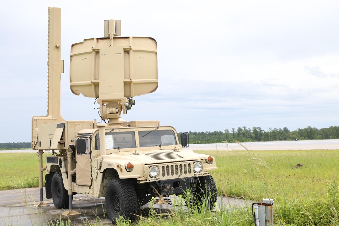 The radar array, for the AN/TPS-31A V7 Air Traffic Navigation, Integration, and Coordination System, tracks aircraft next to Runway 2 during a week-long training exercise at Marine Corps Air Station Cherry Point, N.C., July 17, 2017. The ATNAVICS system is an expeditionary radar system allowing Marines assigned to air traffic control military occupational specialties to establish fully functioning airfields throughout diverse areas of operation.  This was the first time Marines assigned to ATC roles to utilize the system aboard MCAS Cherry Point for training purposes, rather than just for certification on the system prior to deploying.  The system was being utilized by Marines assigned to Air Traffic Control Crew 2, Headquarters and Headquarters Squadron, MCAS Cherry Point and Detachment Charlie, Marine Air Control Squadron 2, Marine Air Control Group 28, 2nd Marine Aircraft Wing. (U.S. Marine Corps Photo by Pfc. Skyler Pumphret/ Released)