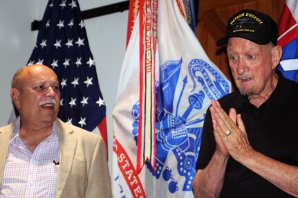 Former Spec. 4 Edward Iannuccilli (left) listens as Ted Howard recounts the details of a helicopter crash April 7, 1970, in Vietnam. Howard, a medical evacuation pilot, was trapped inside the burning wreckage until Iannuccilli was able to free him. Iannuccilli received the Silver Star for his heroic efforts, but only recently had it presented to him at Joint Base San Antonio-Fort Sam Houston July 7. 