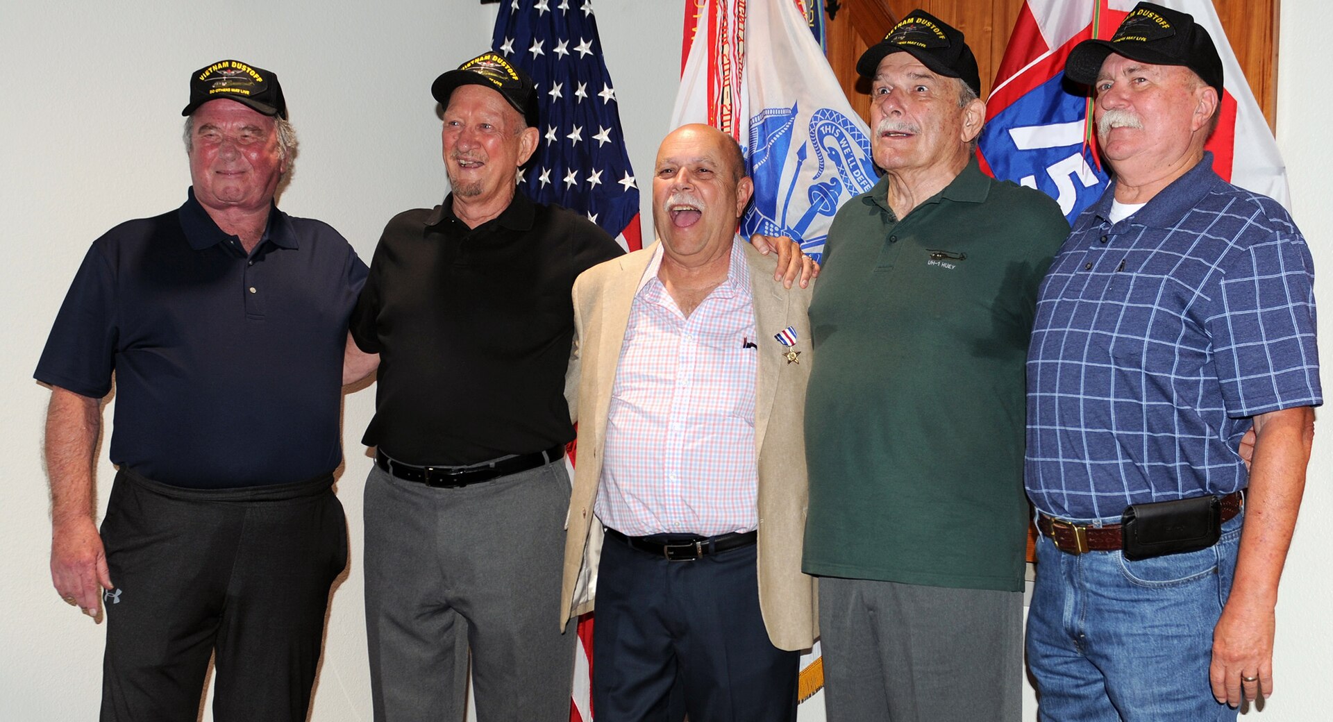 Edward Iannuccilli, center, stands with members of his unit, the 159th Medical Evacuation Company, or Dustoff, following an award ceremony where he received the Silver Star. Iannuccilli, a combat medic in Vietnam, disregarded his own safety to rescue a pilot trapped inside a burning medical evacuation helicopter, while the enemy fired on him and ammunition inside the aircraft exploded. Then-Spec. 4 Iannuccilli rescued Ted Howard (second from left) April 7, 1970. From left to right are are Jim Dixon, Howard, Iannuccilli, Bruce Nelson and Randy Millican. 