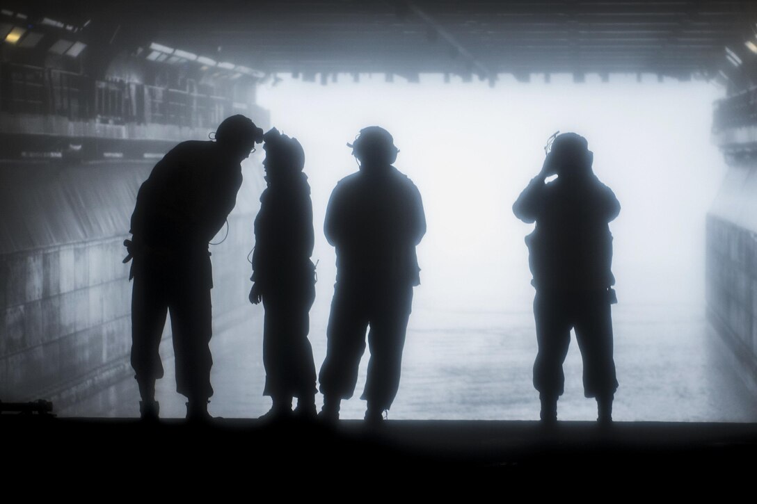 Sailors prepare to guide an air-cushion landing craft into the well deck of the USS Wasp in the Atlantic Ocean, July 17, 2017. The Wasp is acquiring certifications for its upcoming homeport shift to Sasebo, Japan. Navy photo by Petty Officer 3rd Class Levingston Lewis

