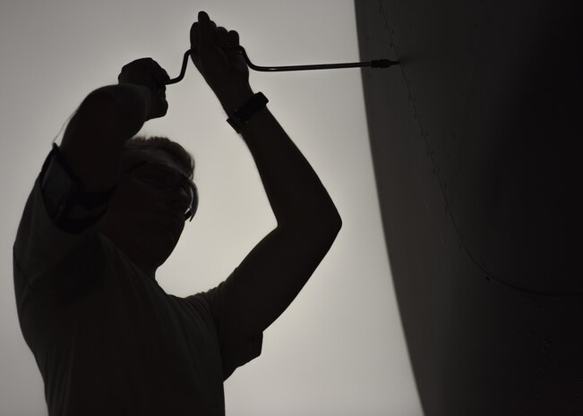 Senior Airman James Crance, 437th Aircraft Maintenance Squadron crew chief, fastens a screw to the exterior of a C-17 Globemaster III at Joint Base Charleston, S.C. July 17, 2017. The 437th AMXS is made up of combat-ready maintainers who inspect and service JB Charleston’s fleet of C-17s. The maintenance these Airmen perform enables Air Mobility Command’s mission to execute and sustain rapid global mobility at a moment’s notice.