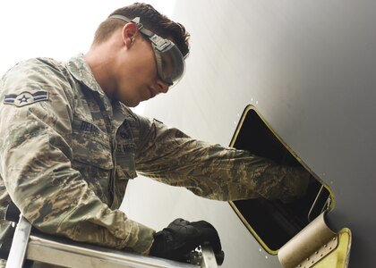 Airman 1st Class Zack Beard, 437th Aircraft Maintenance Squadron crew chief, adds oil to one of four engines mounted on a C-17 Globemaster III at Joint Base Charleston, S.C. July 17, 2017. The 437th AMXS is made up of combat-ready maintainers who inspect and service JB Charleston’s fleet of C-17s. The maintenance these Airmen perform enables Air Mobility Command’s mission to sustain rapid global mobility at a moment’s notice.