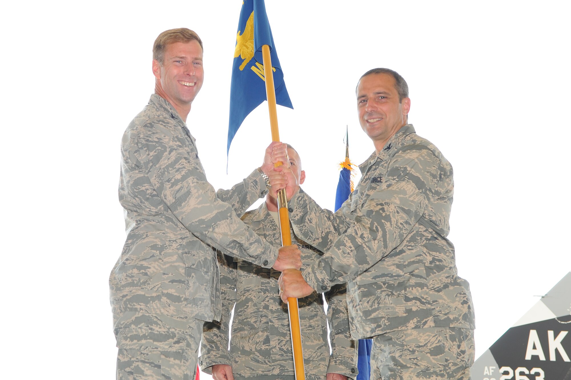 U.S. Air Force Col. David Mineau, the 354th Fighter Wing commander, passes the 354th Maintenance Group (MXG) guidon to Col. Peter Gryzen, the 354th MXG commander, July 18, 2017, at Eielson Air Force Base, Alaska. Gryzen assumed command after completing his Master of Science Degree in National Security Strategy at the National War College in Fort McNair, Washington D.C. (U.S. Air Force photo by Airman Eric M. Fisher)