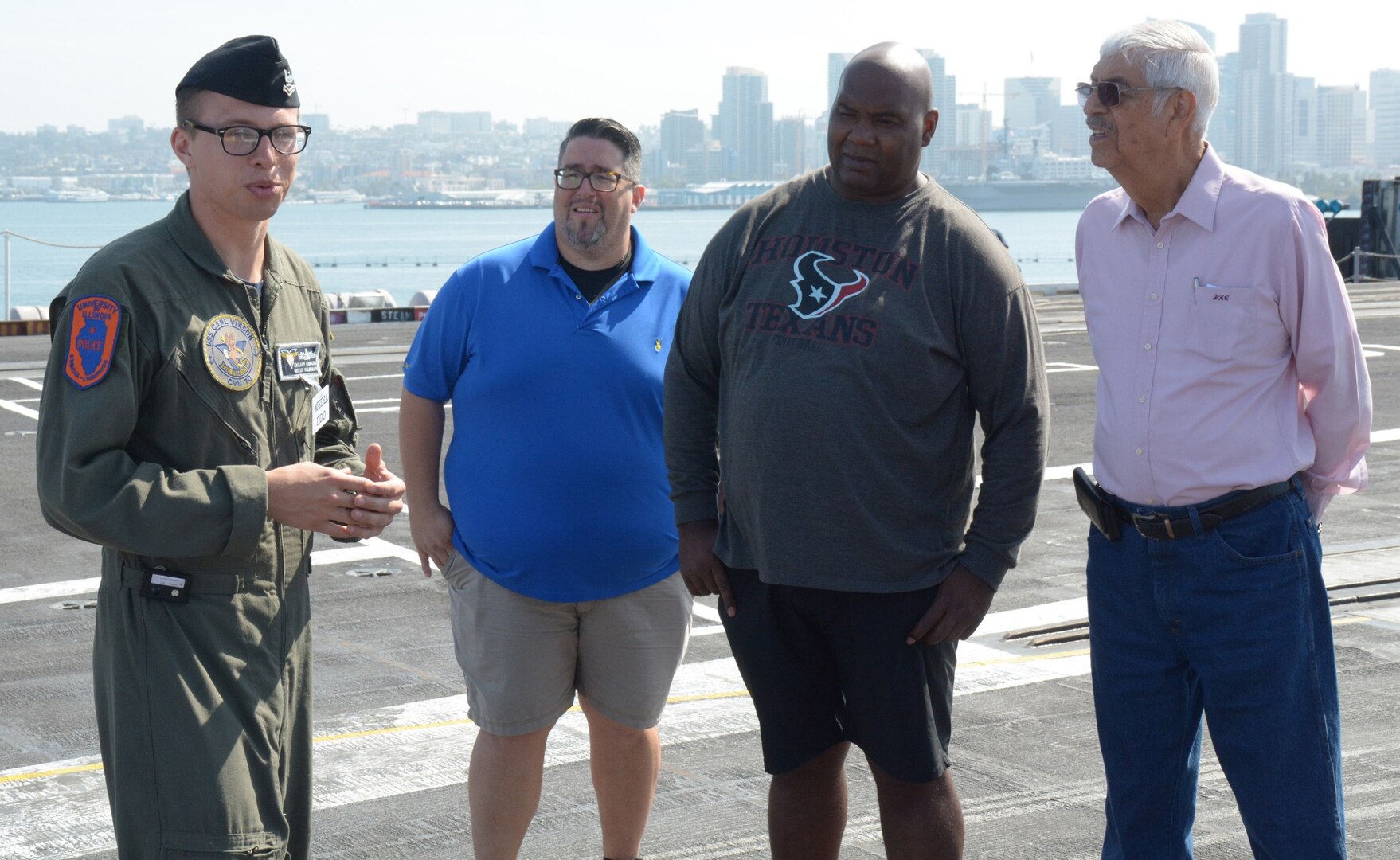 Petty Officer 2nd Class Zackary Landers, Journalism Work Center supervisor assigned to USS Carl Vinson (CVN 70), briefs educators from South Texas on the capabilities of the nuclear powered aircraft carrier during Navy Recruiting District San Antonio’s annual Educators Orientation Visit (EOV). The EOV is a Navy Recruiting Command program with a main focus of showing educators the various facets of the Navy and the many career paths available to students. 