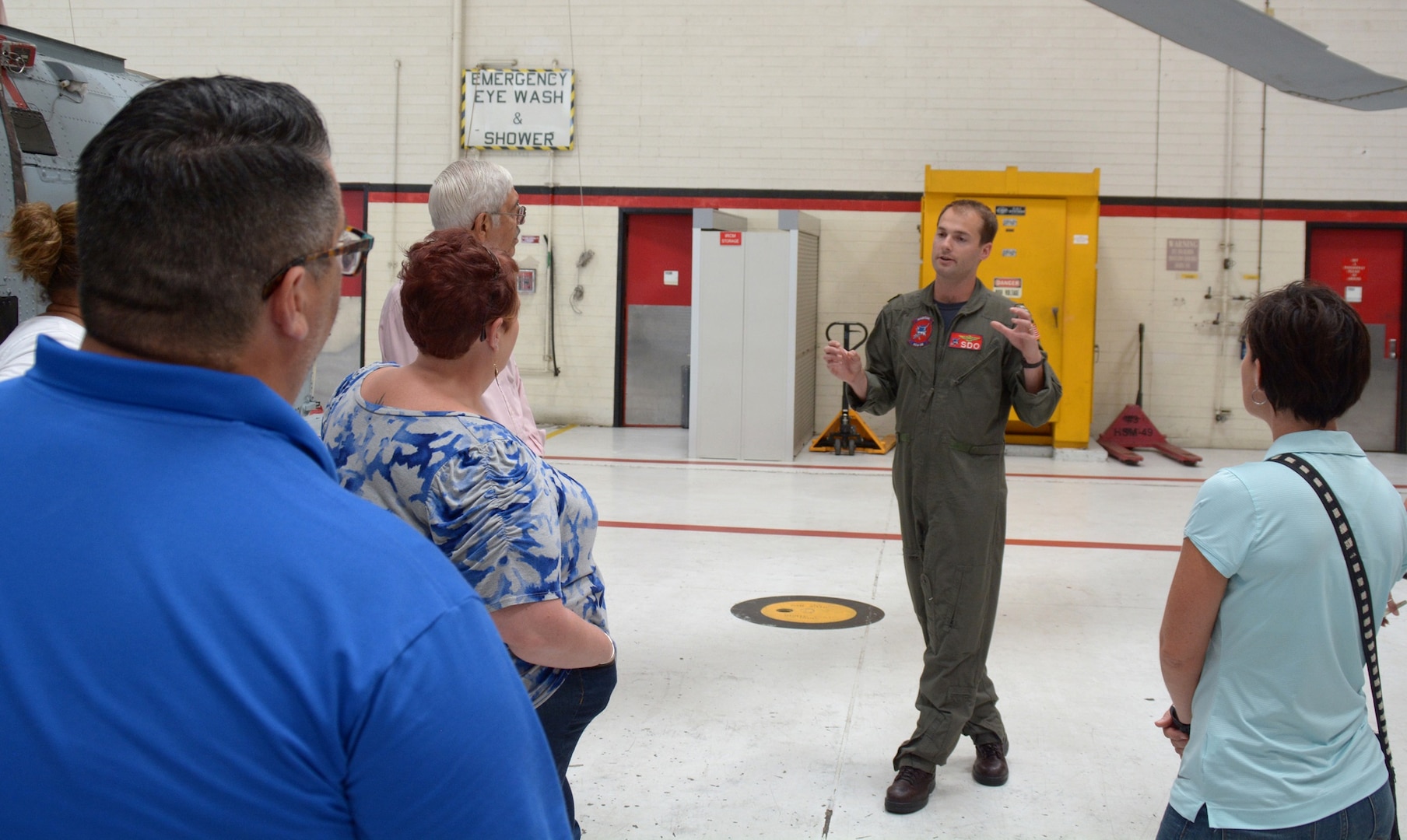 Lakeville, Minn., native Lt. Michael Minneman, a helicopter pilot and quality assurance officer assigned to Helicopter Maritime Strike Squadron Three Five (HSM-35) speaks with educators from South Texas on the capabilities of the MH-60R Sea Hawk helicopter during Navy Recruiting District San Antonio’s annual Educators Orientation Visit (EOV).  Minneman is a 2011 graduate of the University of Virginia and received his commission through the Navy Reserve Officers Training Corps program.  The EOV is a Navy Recruiting Command program with a main focus of showing educators the various facets of the Navy and the many career paths available to students.