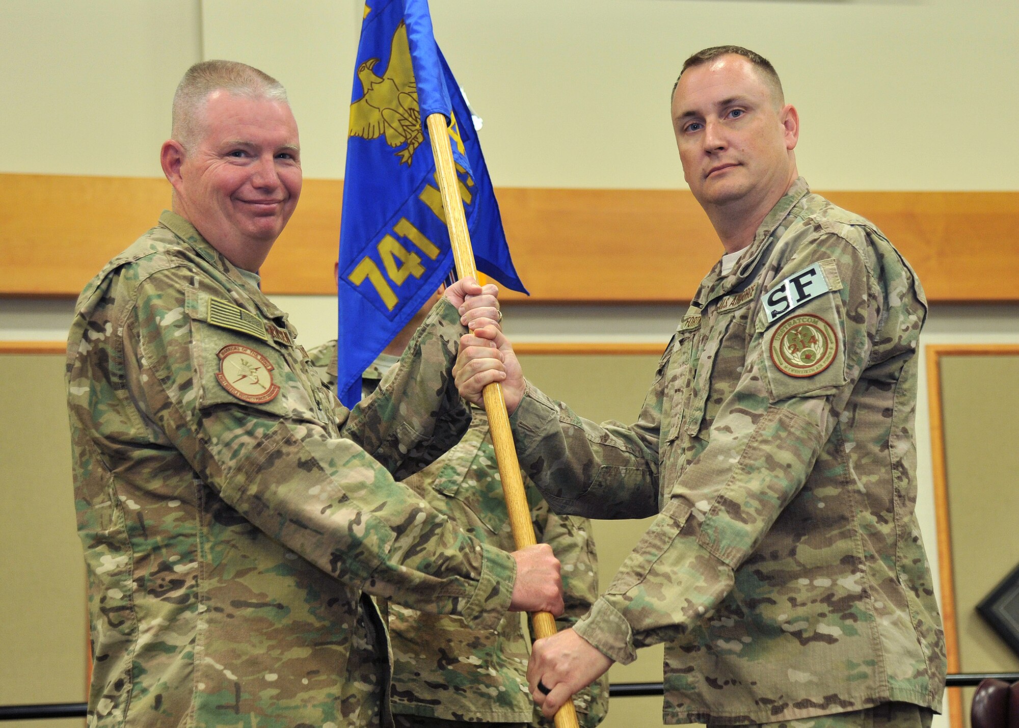 Lt. Col. Raymond Fortner, right, accepts command of the 741st Missile Security Forces Squadron from Col. Robert Frederiksen, 341st Security Forces Group commander July 12, 2017 at Malmstrom Air Force Base, Mont. (U.S. Air Force photo/John Turner)