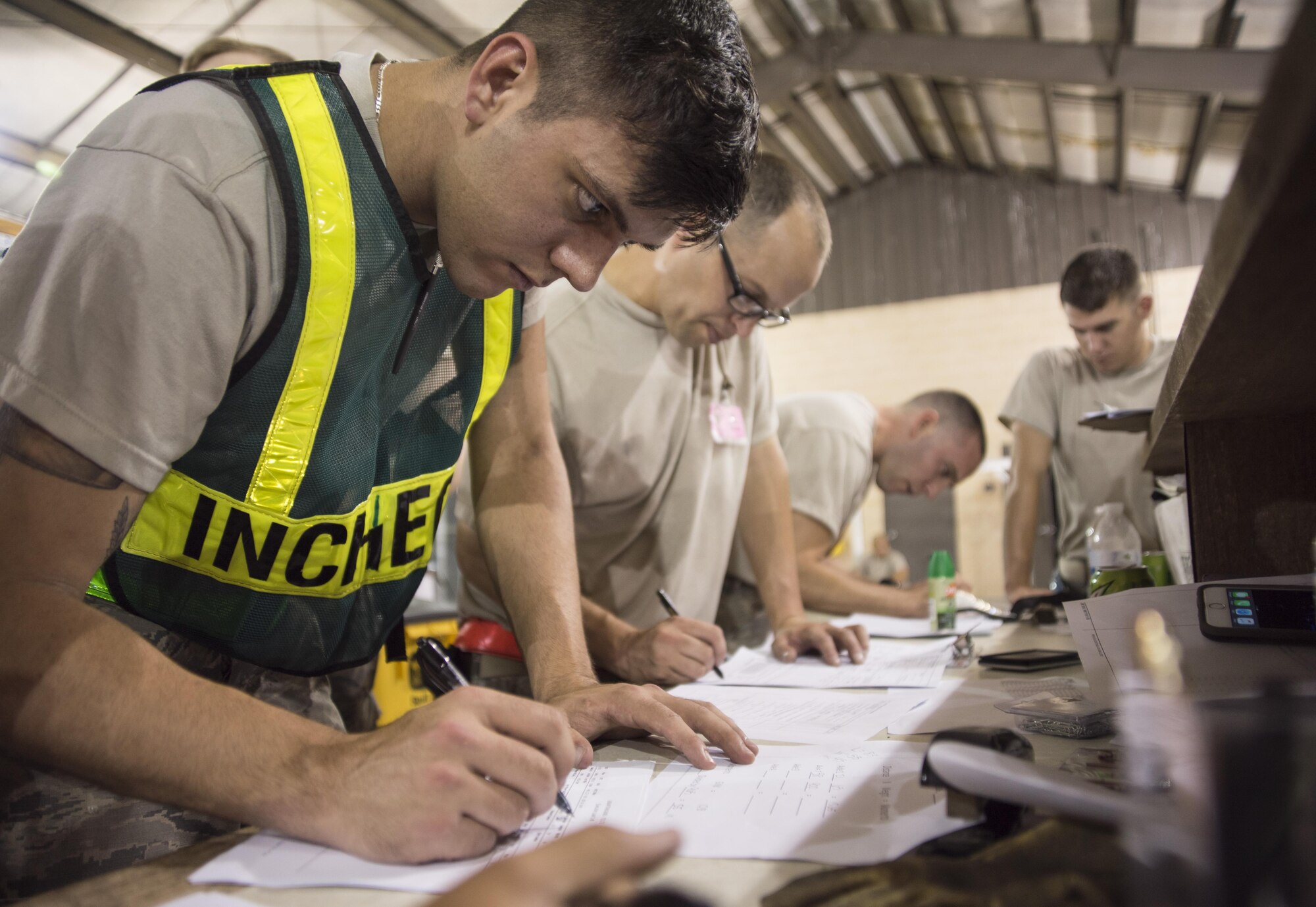 Airman 1st Class Dillon Walker, 4th Logistics Readiness Squadron travel management office, completes paperwork for cargo that will be loaded onto an aircraft July 20, 2017, at Seymour Johnson Air Force Base, North Carolina. Walker is responsible for ensuring the accurate dimensions and weight of the cargo prior to being loaded onto an aircraft. (U.S. Air Force photo by Tech. Sgt. David W. Carbajal)